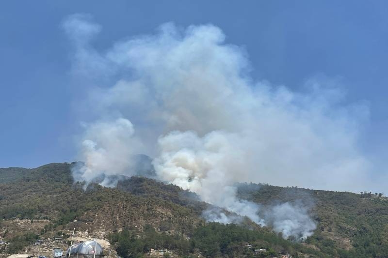 Water from helicopter to control fire in Shivapuri