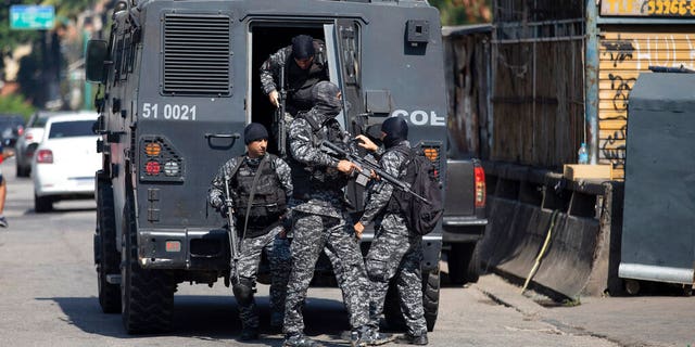 At least 25 people have been killed in a shootout between police and smugglers in Rio de Janeiro