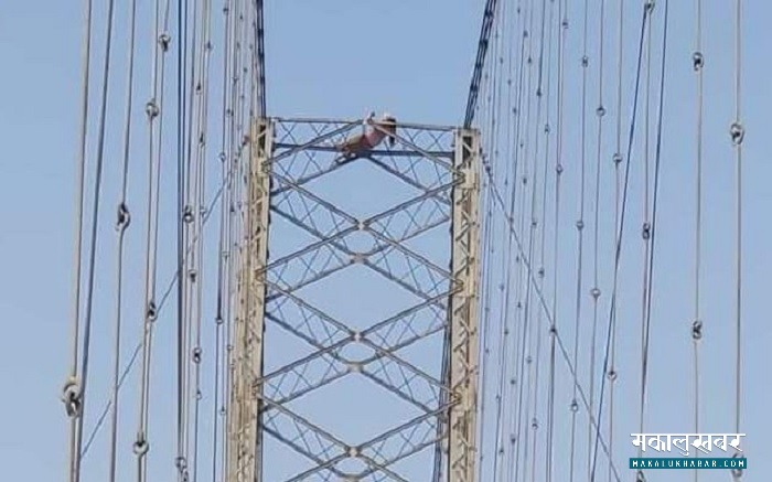 Woman doing yoga on the top of the bridge tower