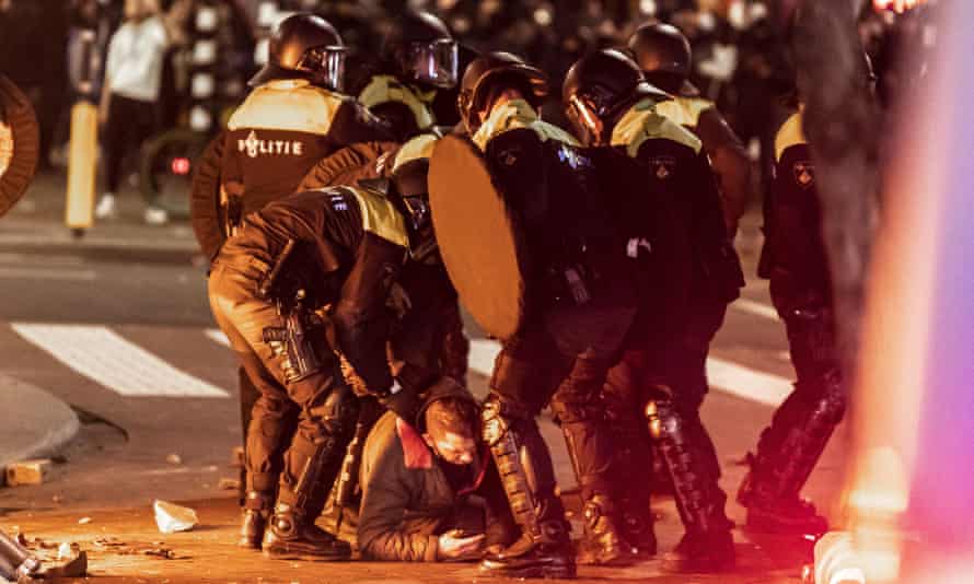 Rotterdam police clash with rioters as Covid protest turns violent