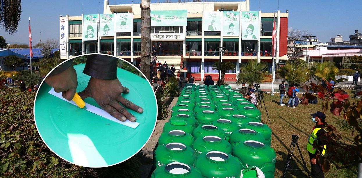 Making holes in plastic tanks to make ballot boxes