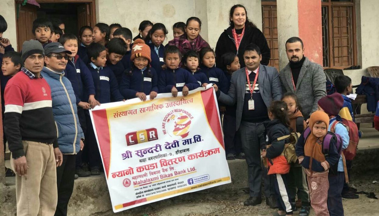 Mahalaxmi Bikas Bank distributes warm clothes to students