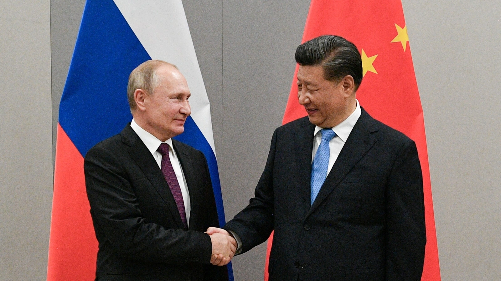 Putin hails Russia’s ‘stabilising role’ before meeting with Xi