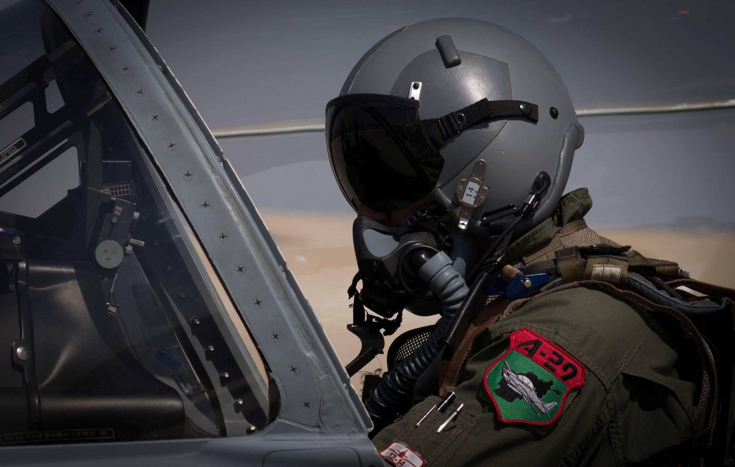 Afghan airforce pilot returns to country with family