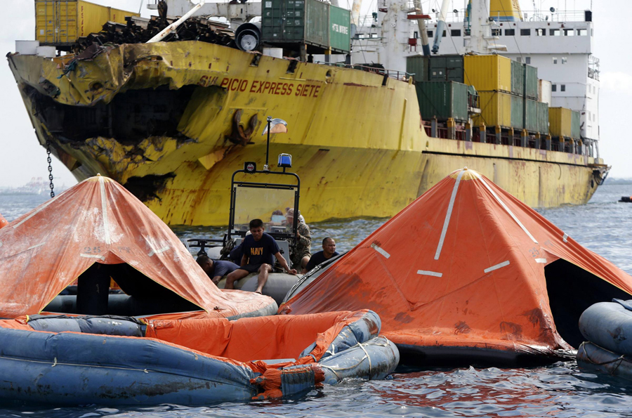 Rescuers search for 8 missing crew members in ship collision in Philippines