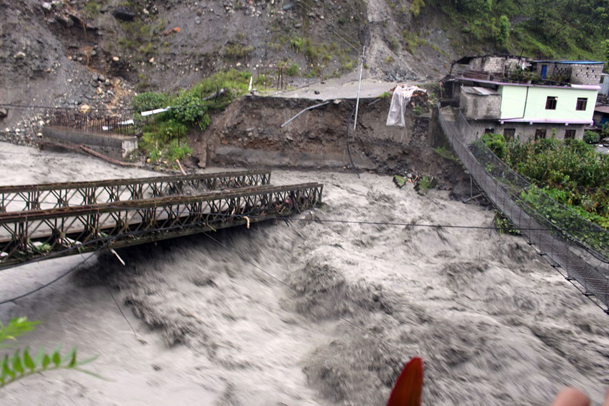 People’s mobility halts after flood sweeps away bridge