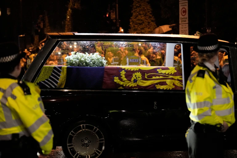 Queen’s coffin arrives at Buckingham Palace as crowds gather