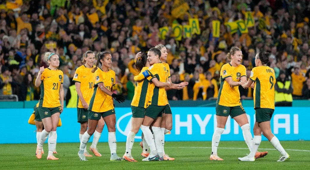 Co-host Australia reaches quarterfinals with win over Denmark