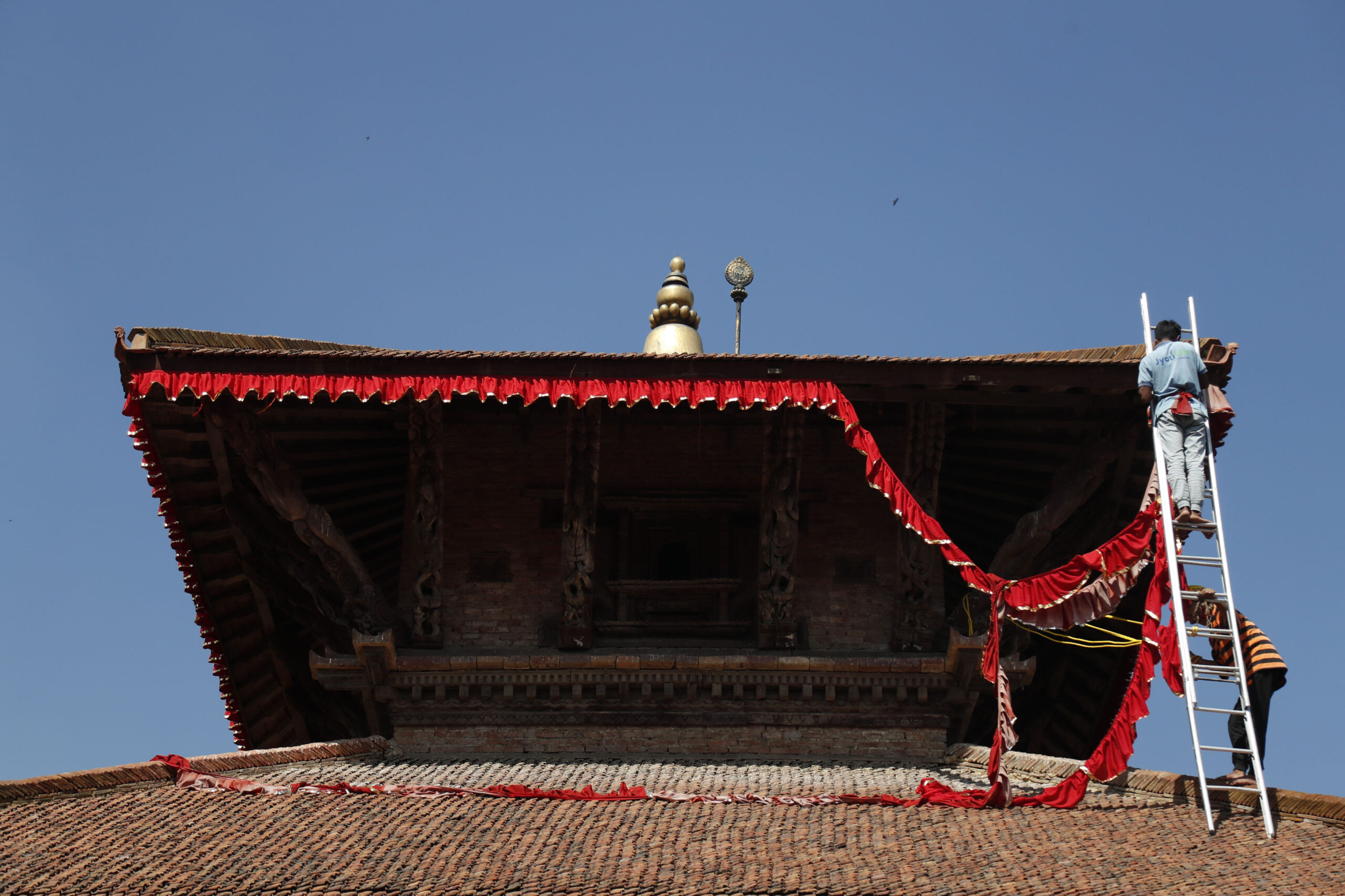 New flag adorns Basantapur Durbar Square temple as festivals near (photos)