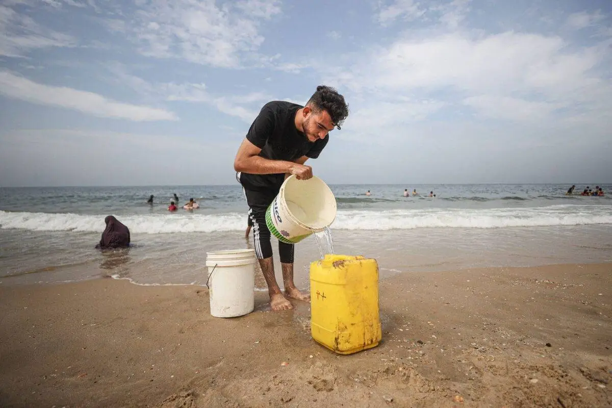 As the conflict escalates, residents of Gaza turn to the sea for water shortages