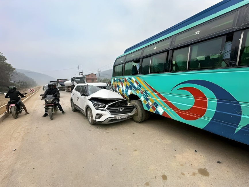 Car collides with stopped bus, 3 injured including car driver