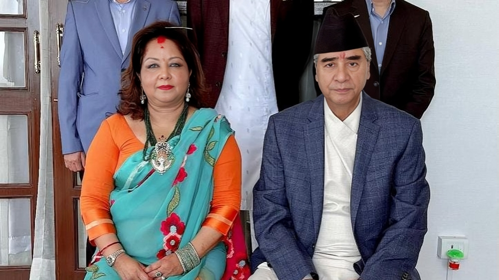 Deuba, accompanied by Arzu, meets Madhav Nepal