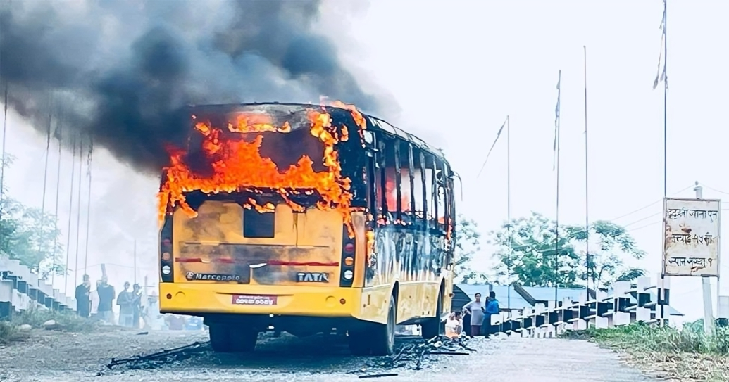 Unknown group sets school bus ablaze