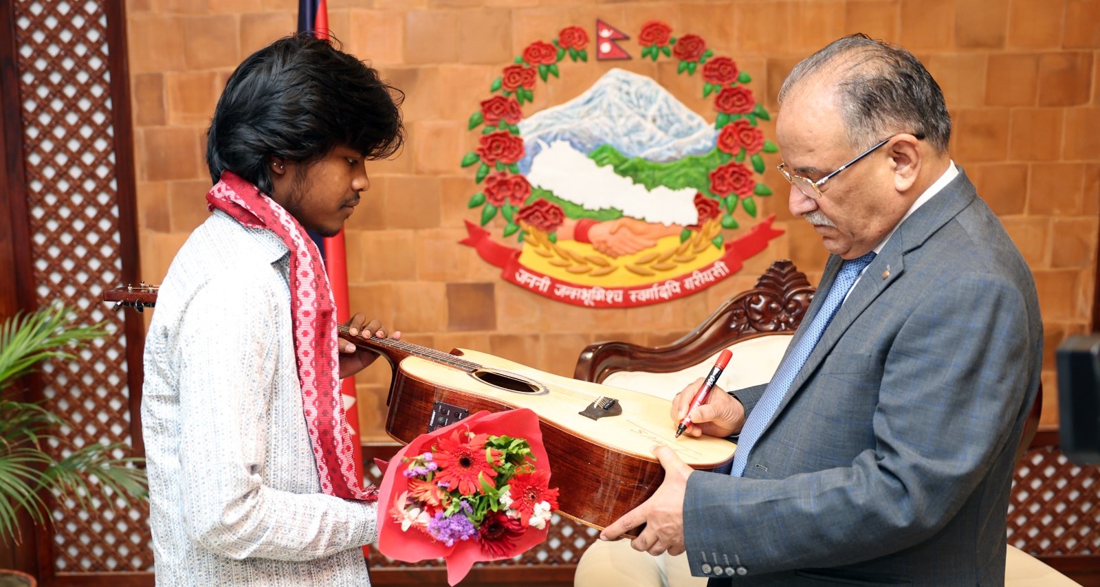 Nepal Idol SO5 winner Karan Pariyar meets PM Prachanda, receives guitar gift (photos)