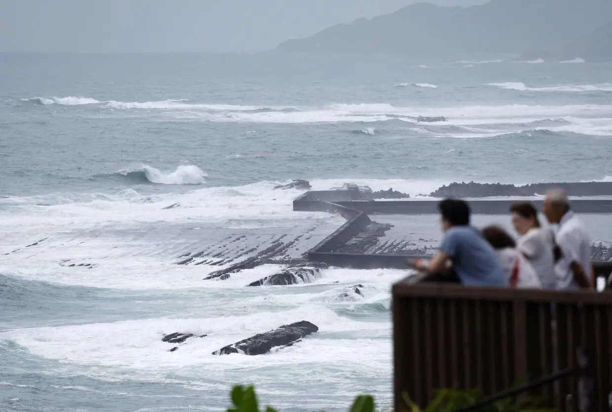 Four missing in landslide as typhoon rains lash Japan