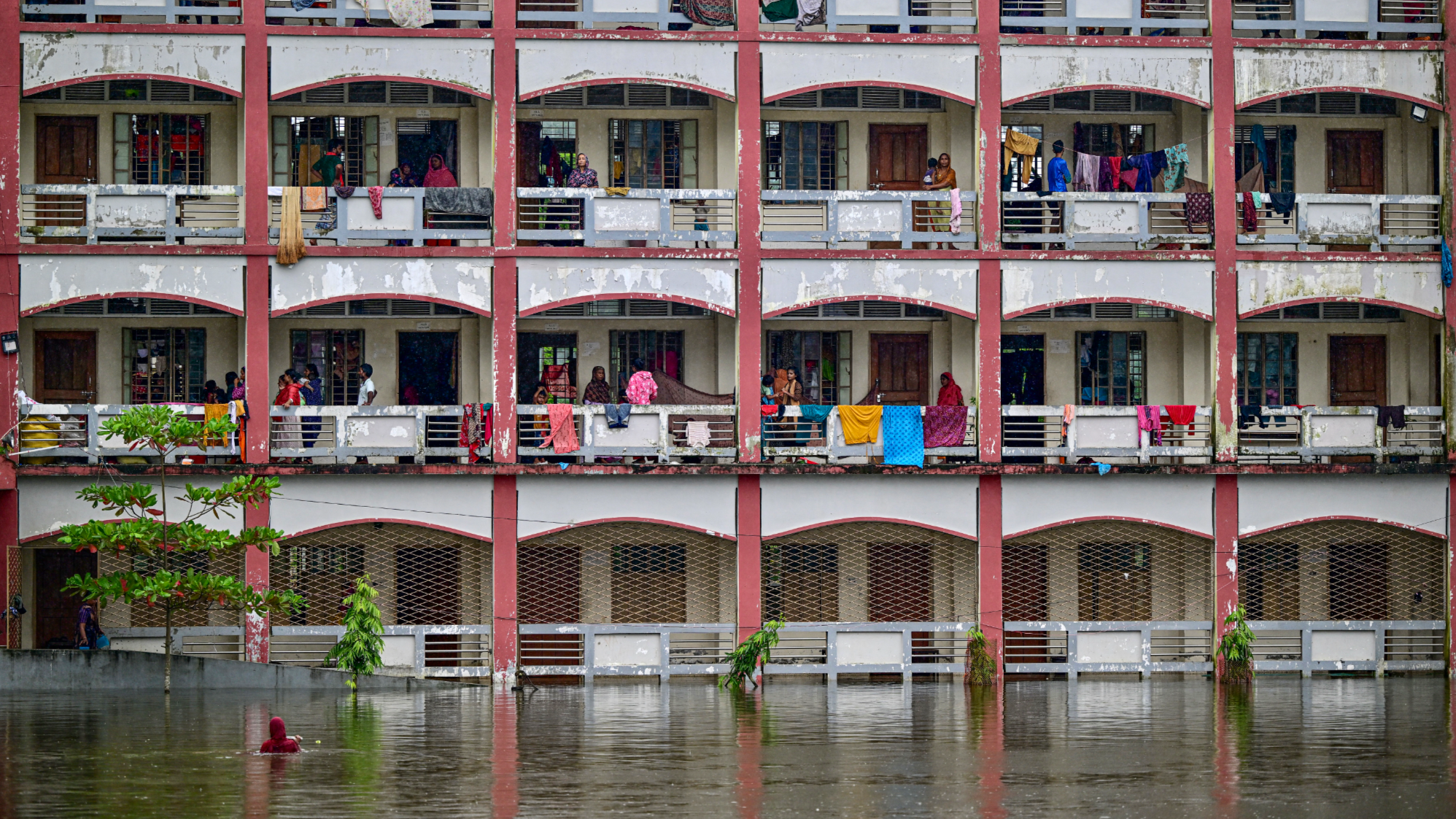 Flash floods in northern Bangladesh leave hundreds of thousands stranded, at least six dead