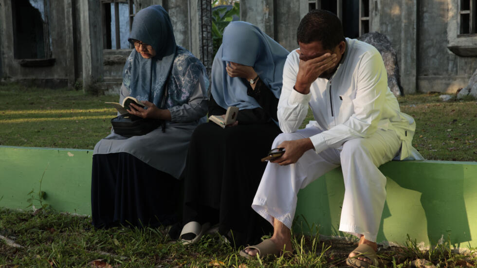 Tears, prayers as Asia mourns tsunami dead 20 years on