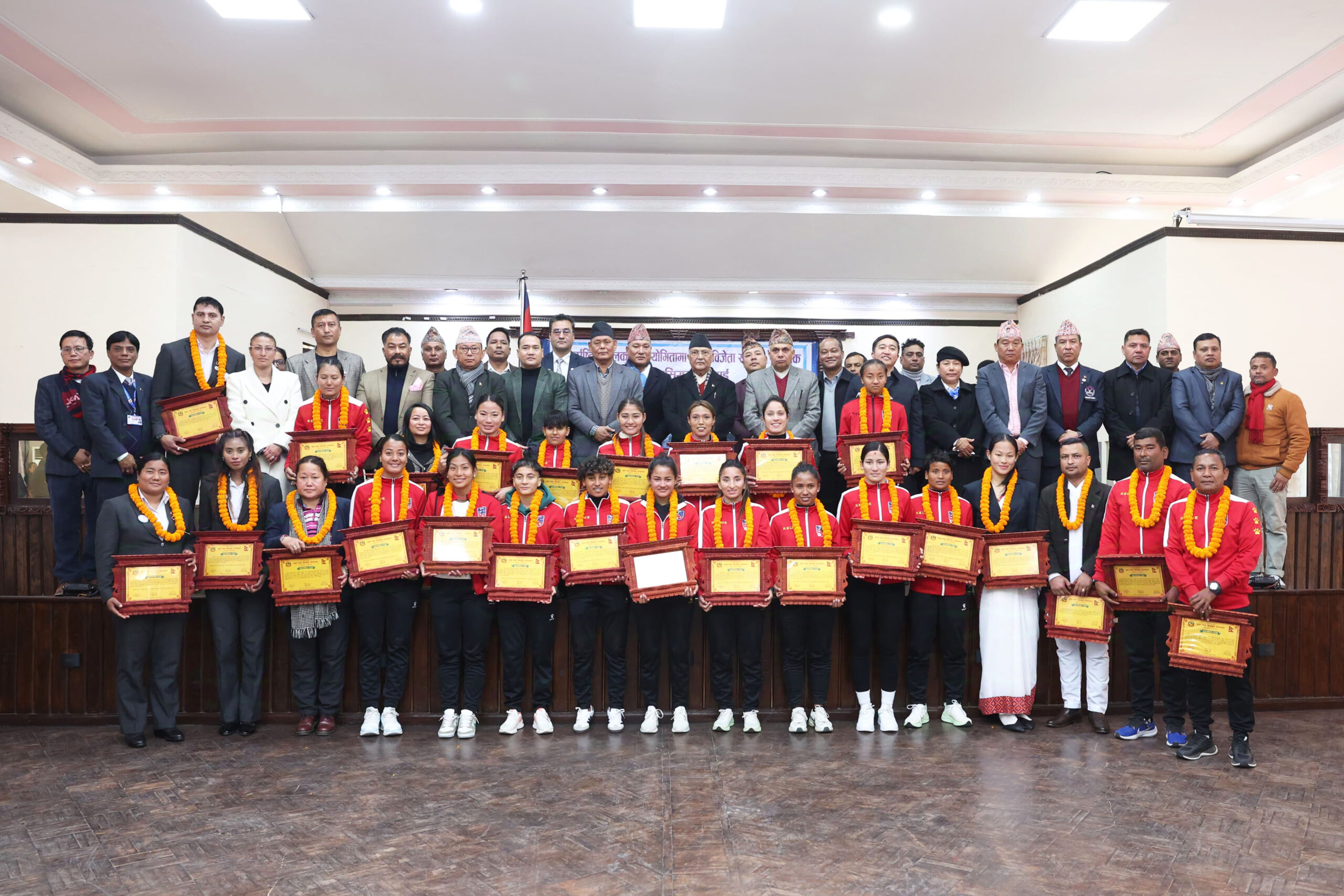 PM Oli hands prize to medal winning players of int’l sports championship