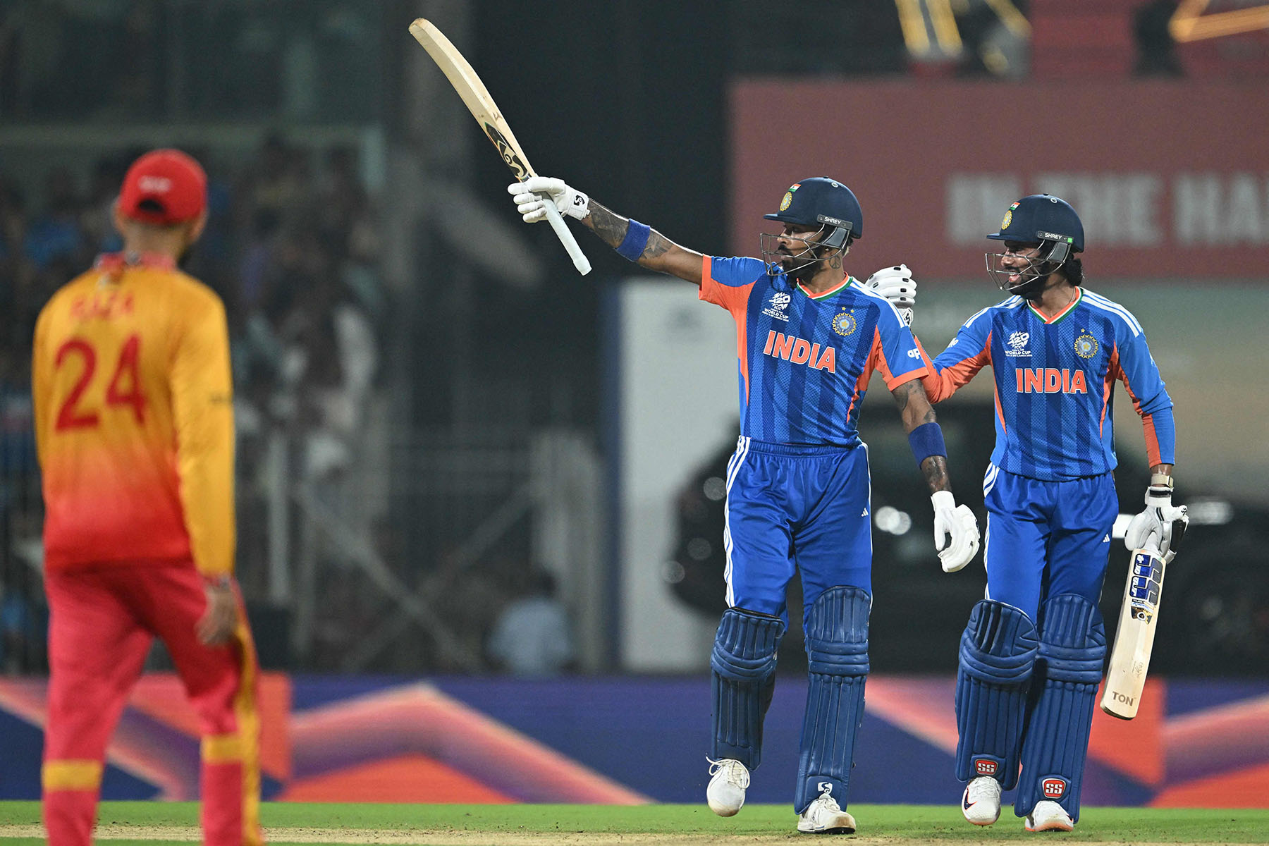 India keep semi-final hopes alive with win over Zimbabwe (photos)