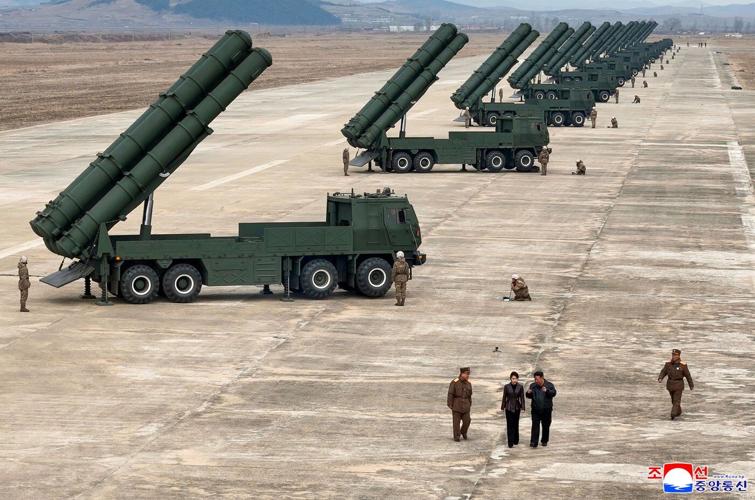 North Korean leader Kim observes test of rocket launch systems with his daughter