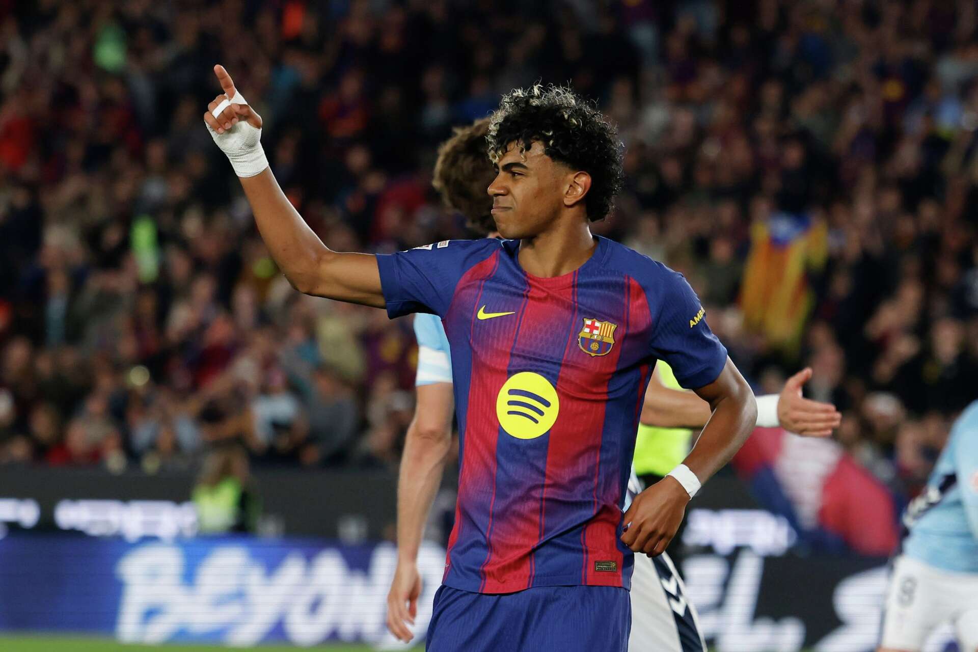 Yamal scores, injured as Barcelona edge Celta to extend lead