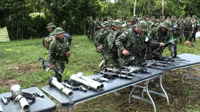 100 Colombian guerrillas disarm in deal with leftist government
