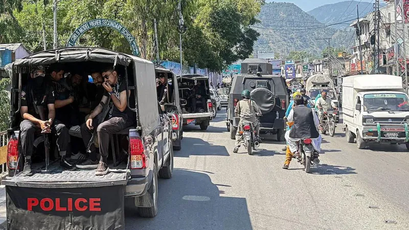 Thousands march in Pakistan-administered Kashmir as clashes kill at least 15